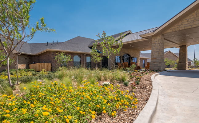 Exterior view of Ashton Medical Lodge with landscaping