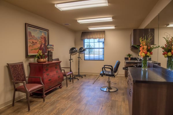 Beauty salon area with chairs and decorations