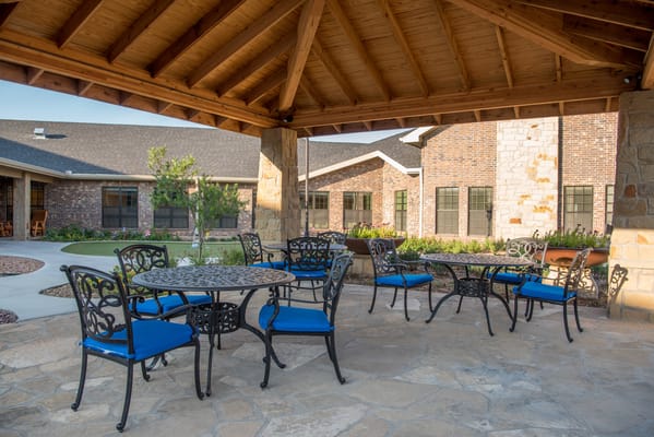 Outdoor seating area with tables and chairs