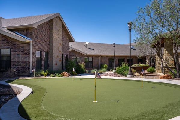 Outdoor putting green in a senior living facility