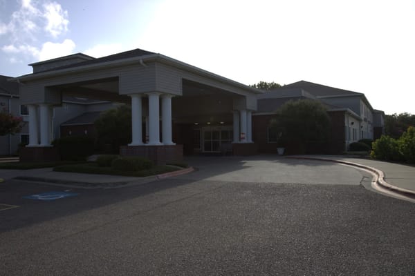 Entrance view of the Garden Estates facility with a sheltered entrance