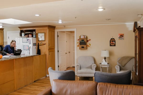 Bright interior of a common area with seating and kitchen