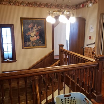 Interior view of a stairwell with wooden railings