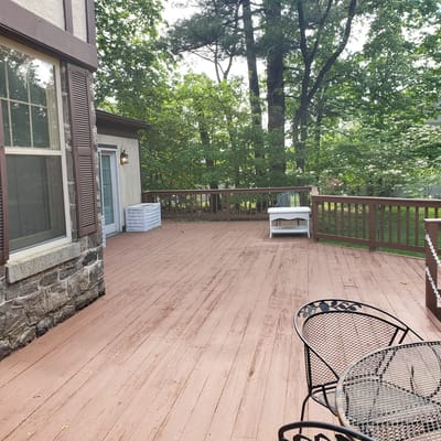 Outdoor patio area with seating and greenery