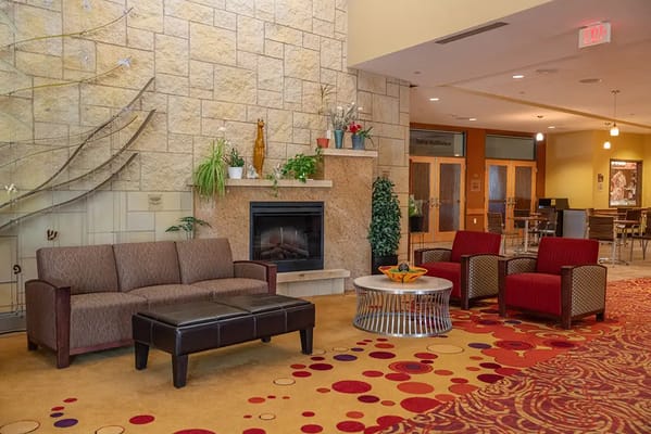 Interior common area with seating and fireplace