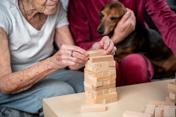 Residents playing a stacking game together