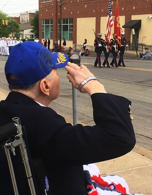 A veteran saluting at a parade