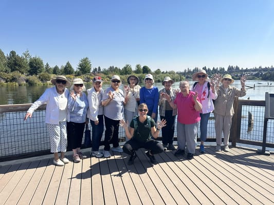 Group of seniors enjoying an outdoor activity by the water