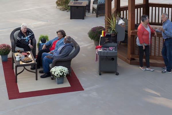 Residents enjoying an outdoor gathering with food and drinks