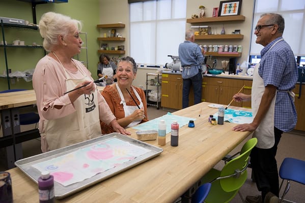 Residents engaged in a creative painting activity