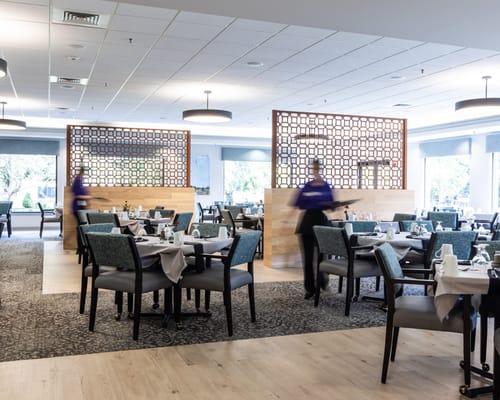 Dining room setup with staff serving