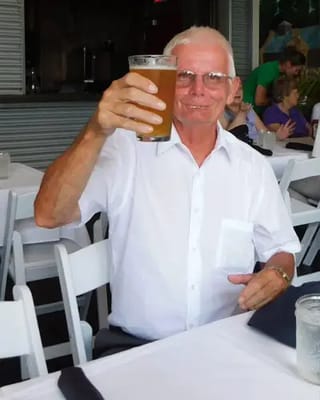 Resident enjoying a drink at a social gathering