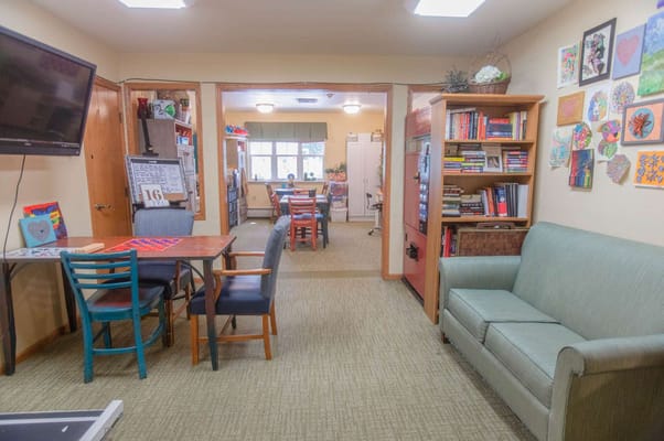 Bright activity room with seating and artwork