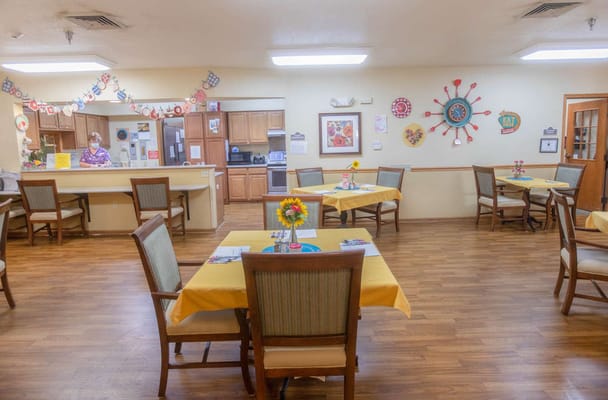 Bright dining room setup with cheerful decor and staff