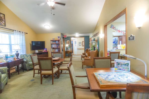 Bright common area with residents engaged in activities