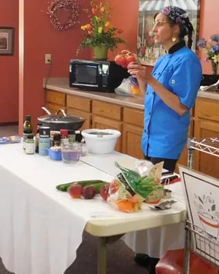 Staff member preparing food in the dining area