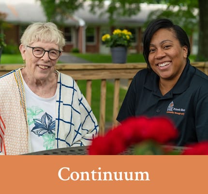 Resident and staff member enjoying time outdoors