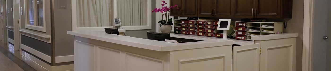 Reception area with a desk and storage cabinets