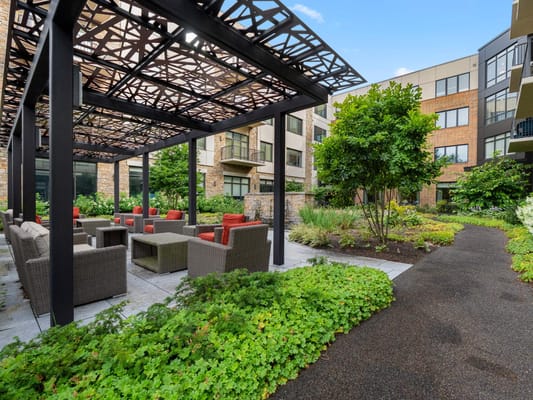 Outdoor seating area with plants and landscaping