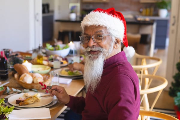 A resident enjoying a festive meal with decorations