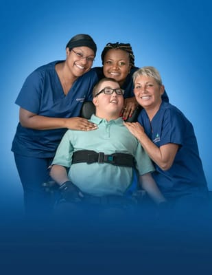 Care staff with a resident in a warm setting