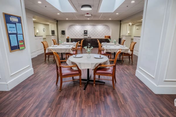 Dining room setup with tables and chairs