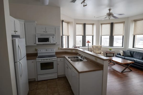 Bright, modern kitchen and living area in a resident unit
