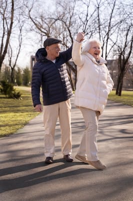 Elderly couple enjoying a walk in the park