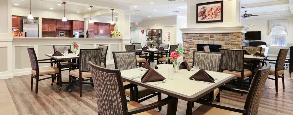 Dining area with tables set for residents