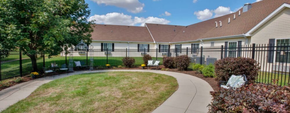 A garden space with seating in a senior living facility