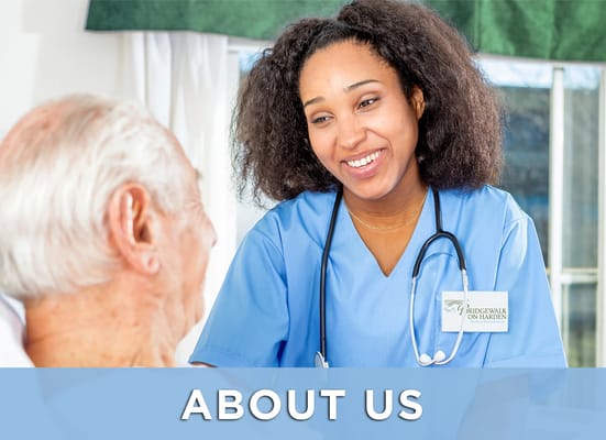 Nurse interacting with a resident in an interior setting