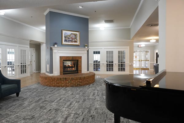 Interior view of a cozy common area with a fireplace