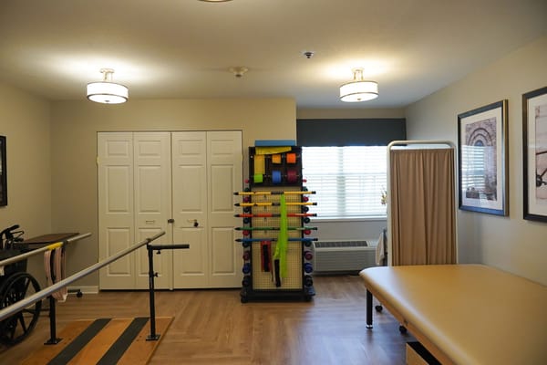 Therapy room with exercise equipment and natural light