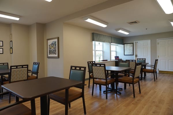 Bright dining area with tables and chairs
