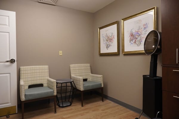 Interior room with chairs and artwork on the wall