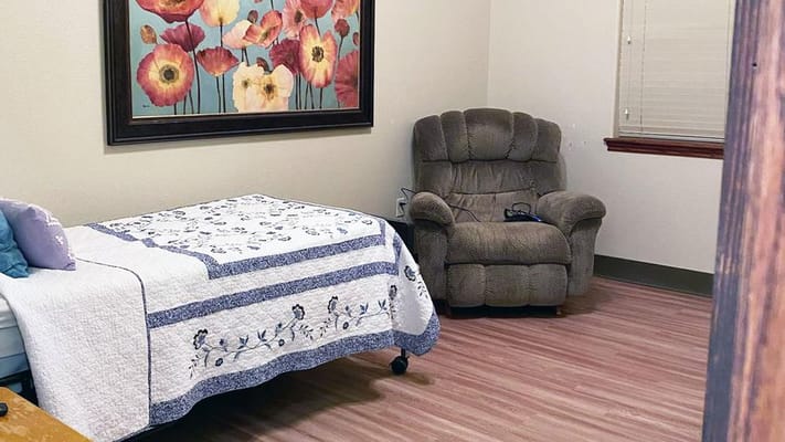 Cozy resident room with floral artwork