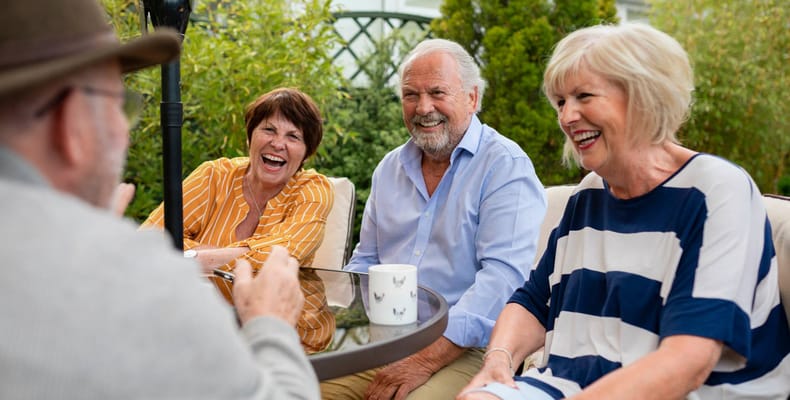 Residents enjoying a conversation in an outdoor space
