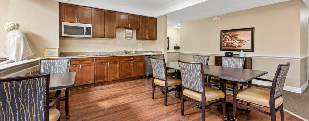 Dining area with tables and kitchen amenities
