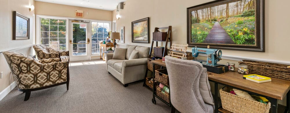 Interior view of a cozy common area with seating and decor