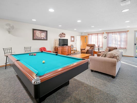 Interior view of a game room with pool table
