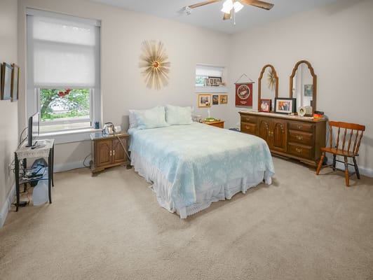 Cozy resident room with a bed and personal decorations