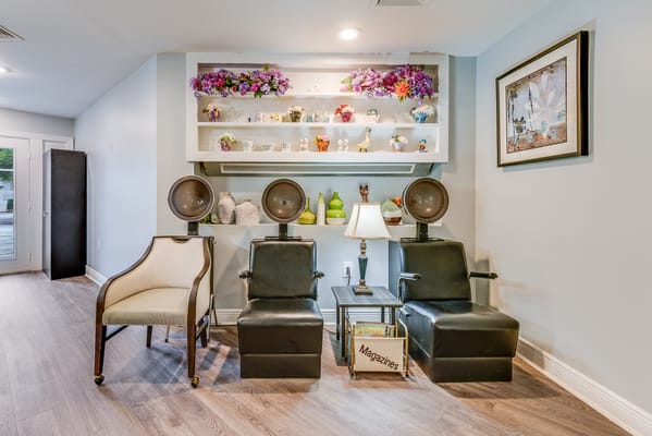 Interior salon area with hairdryers and decorative items