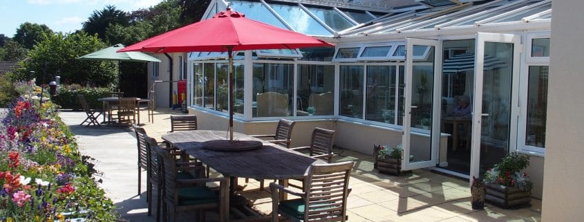 Outdoor patio area with tables and umbrellas