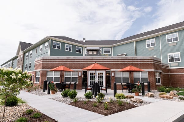 Exterior view of a facility with patio seating