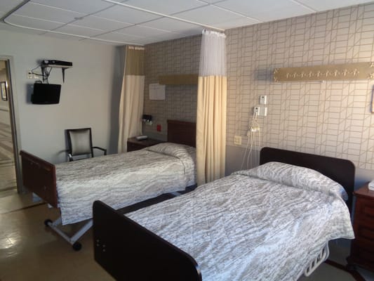 Private room with two beds in a senior care facility