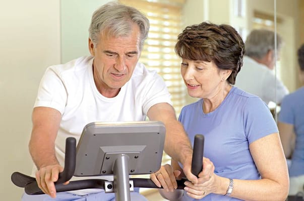 Residents exercising together in a fitness area