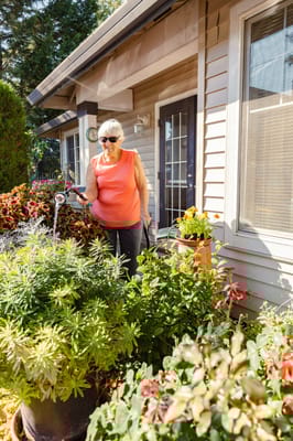 Resident gardening outside the facility