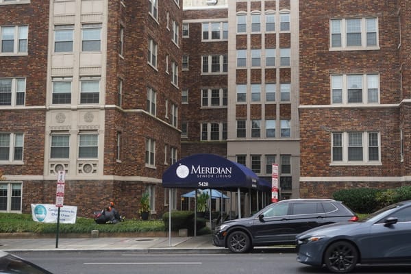 Exterior view of the facility's entrance with a branded awning