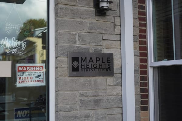 Sign for Maple Heights Senior Living on a building exterior