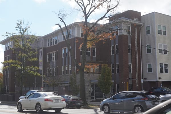 Exterior of Maple Heights Senior Living facility with parking lot